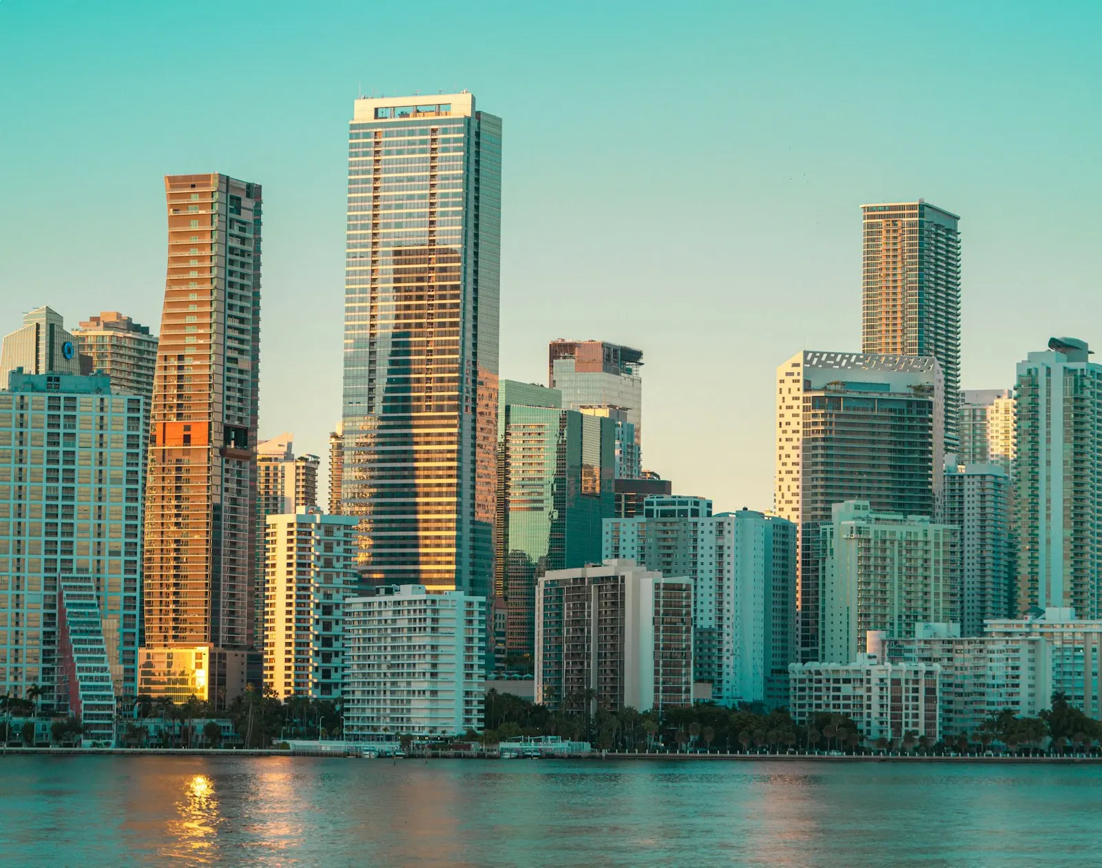 Brickell's waterfront skyline in warm evening light, Miami